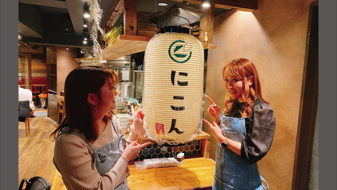 にこんで働く人の写真2枚目